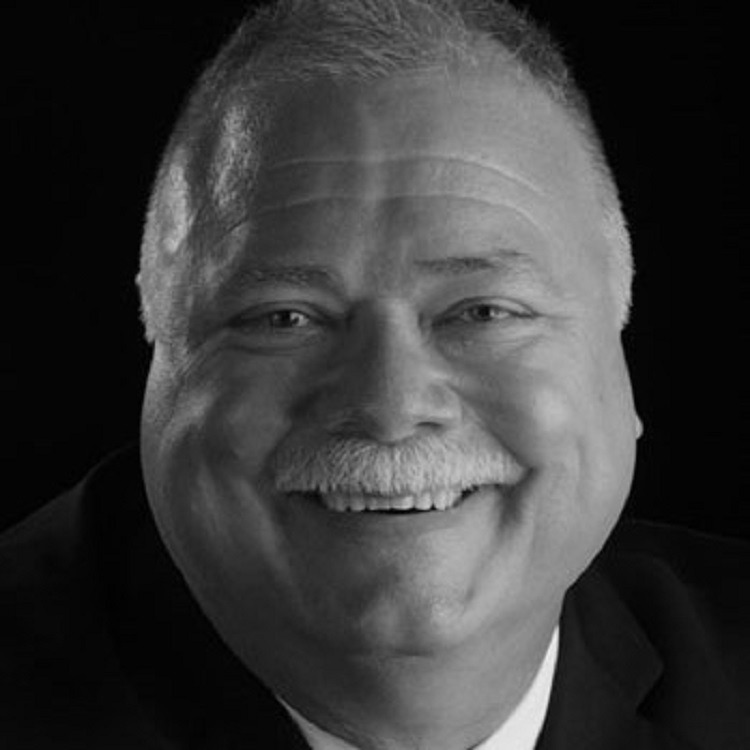 Black and white image of a smiling man
