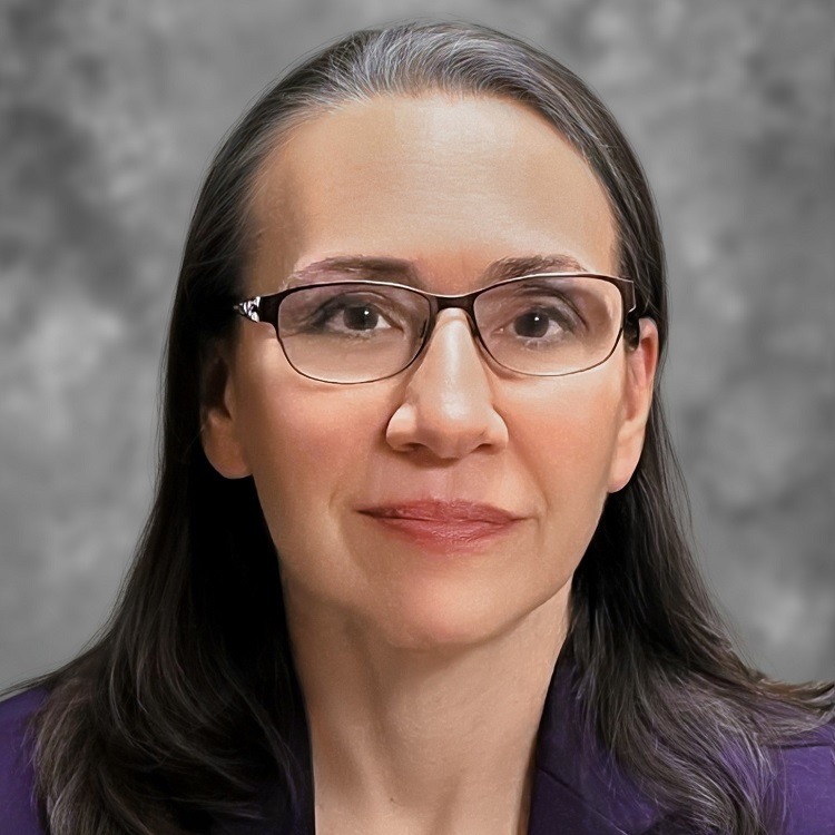 Woman with dark hair, wearing glasses